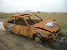 [Burnt-out car on Shorne Marshes]