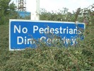 ['No Pedestrians' road sign]